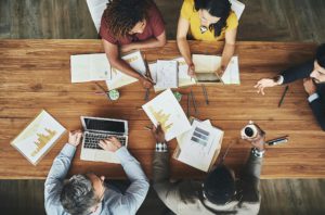 Diverse group of professionals around a table