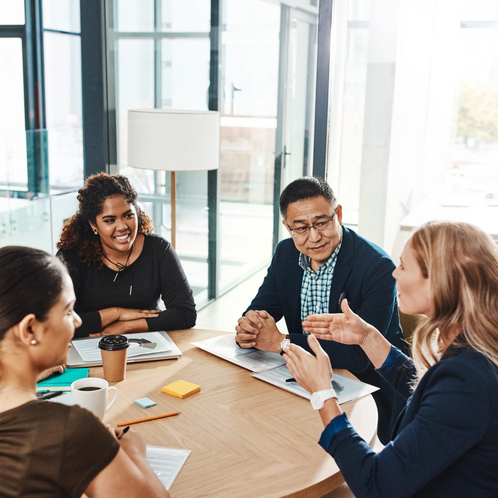 Diverse group of professionals around a table