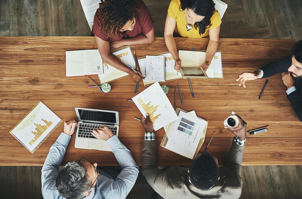 Diverse group of professionals around a table