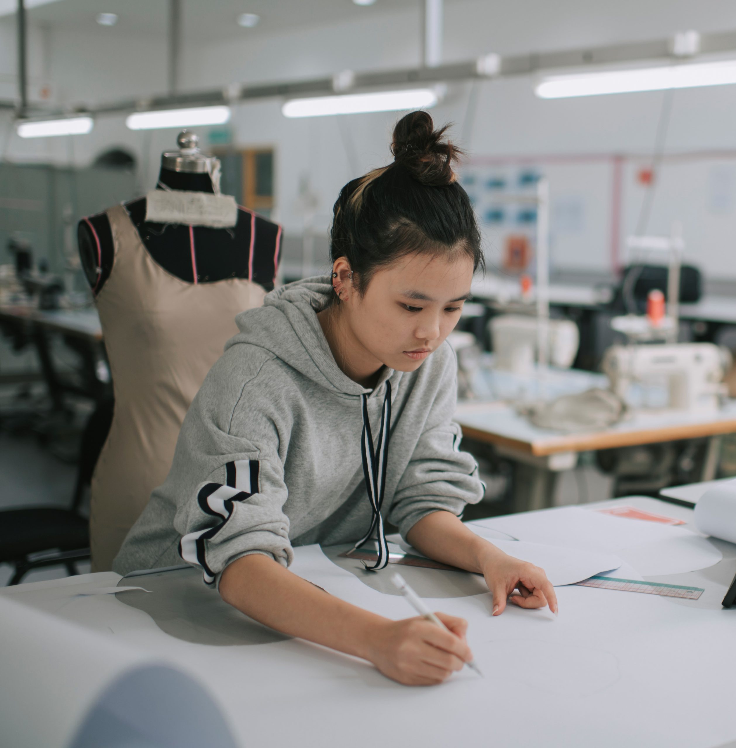 Asian woman designing clothes