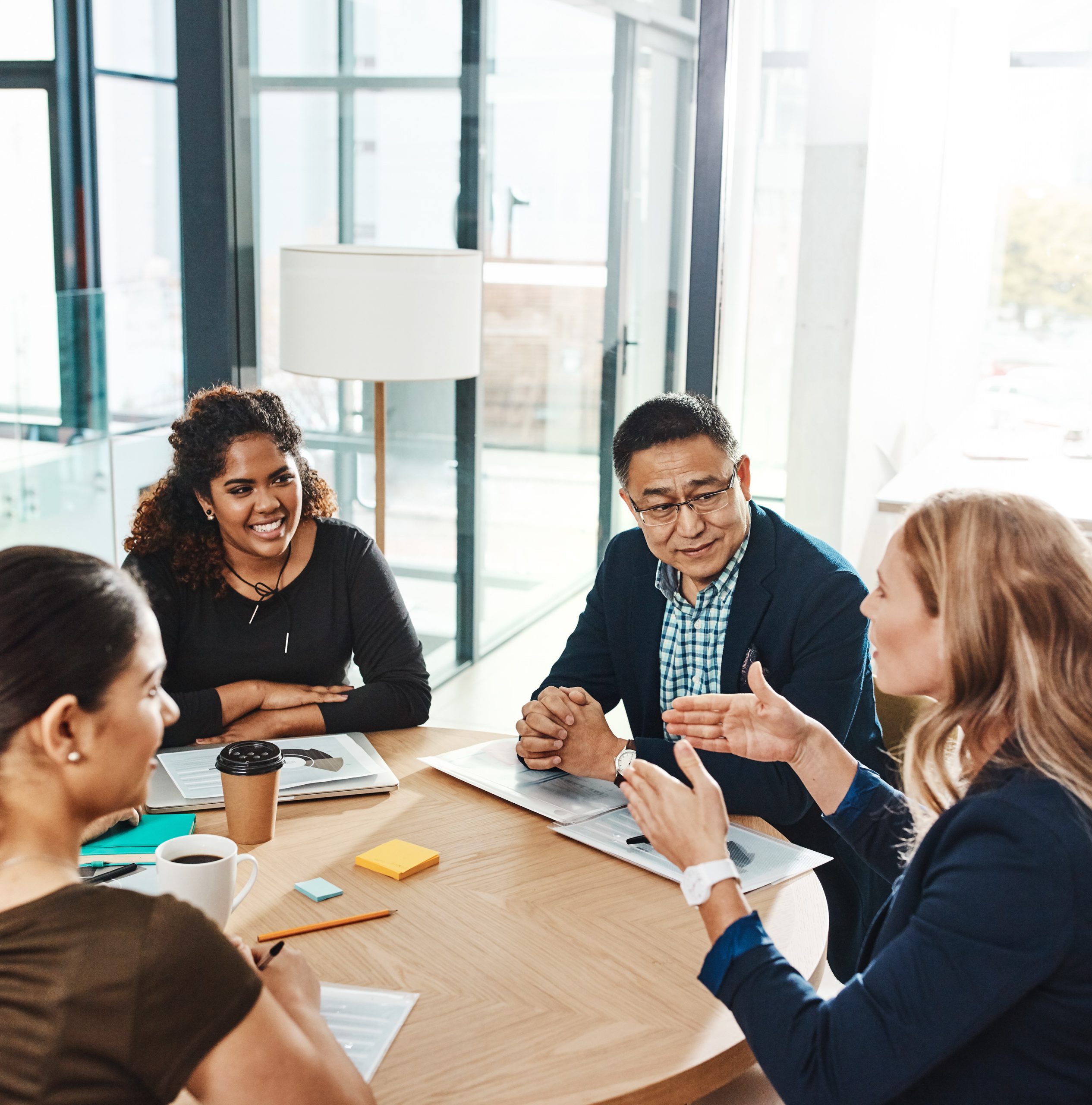 Diverse group of professionals around a table